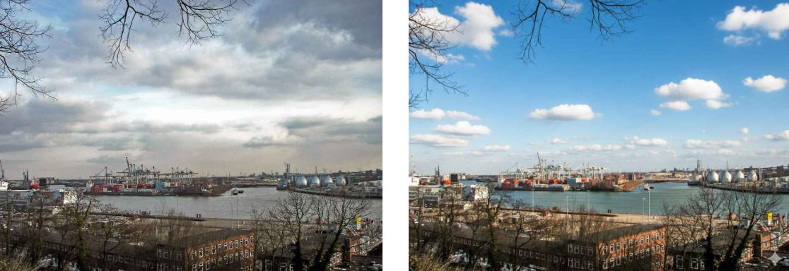 Change the overcast sky in the image to a blue sky with white clouds