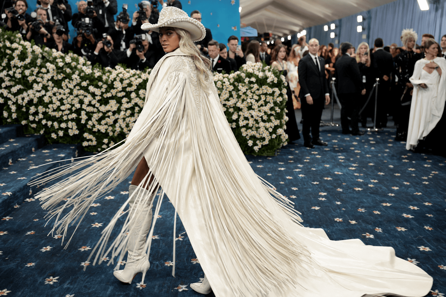 A cowboy metamorphosis in a fringe leather cape on the met gala red carpet