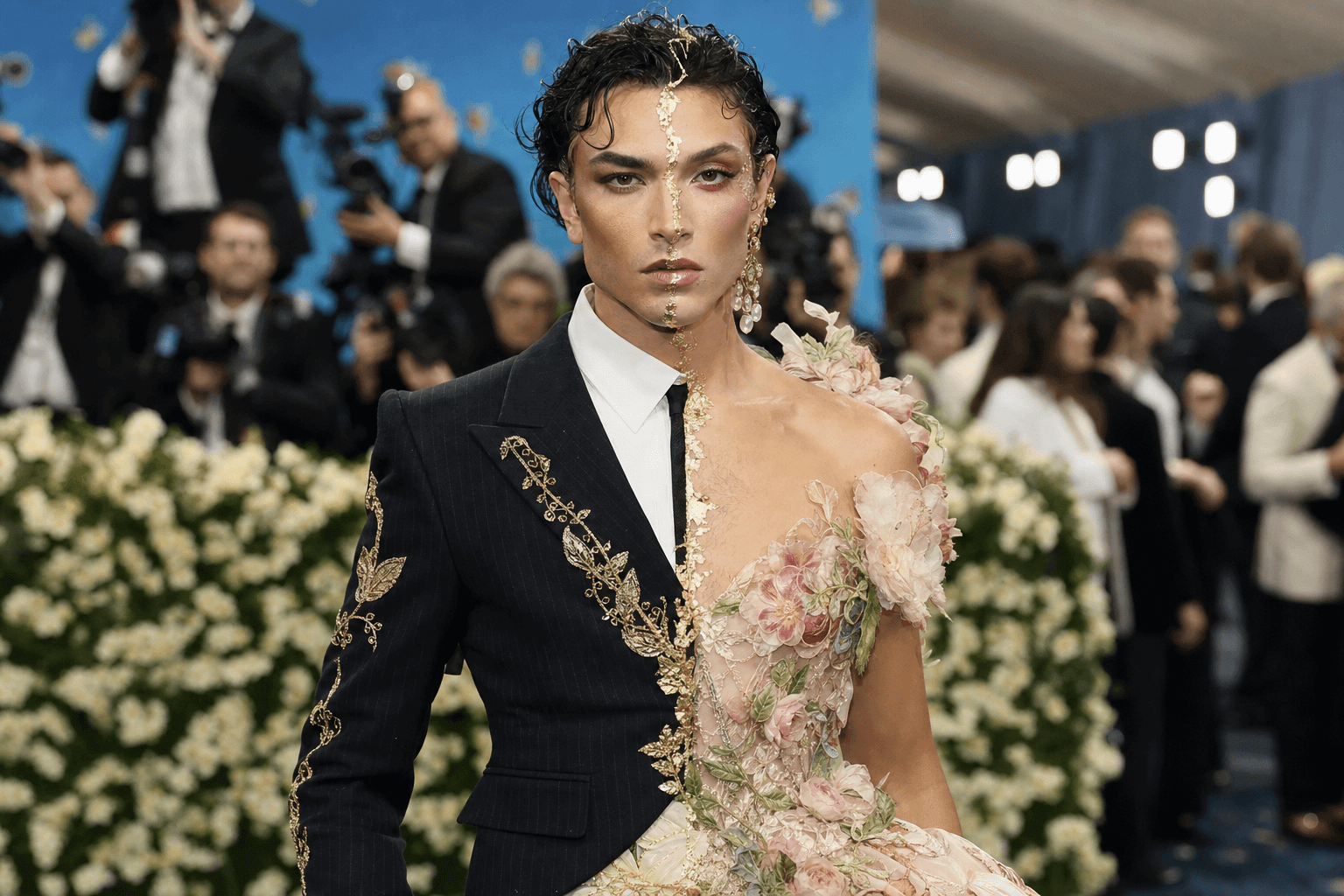 A fluid bloom in a half suit half ballgown on the met gala red carpet