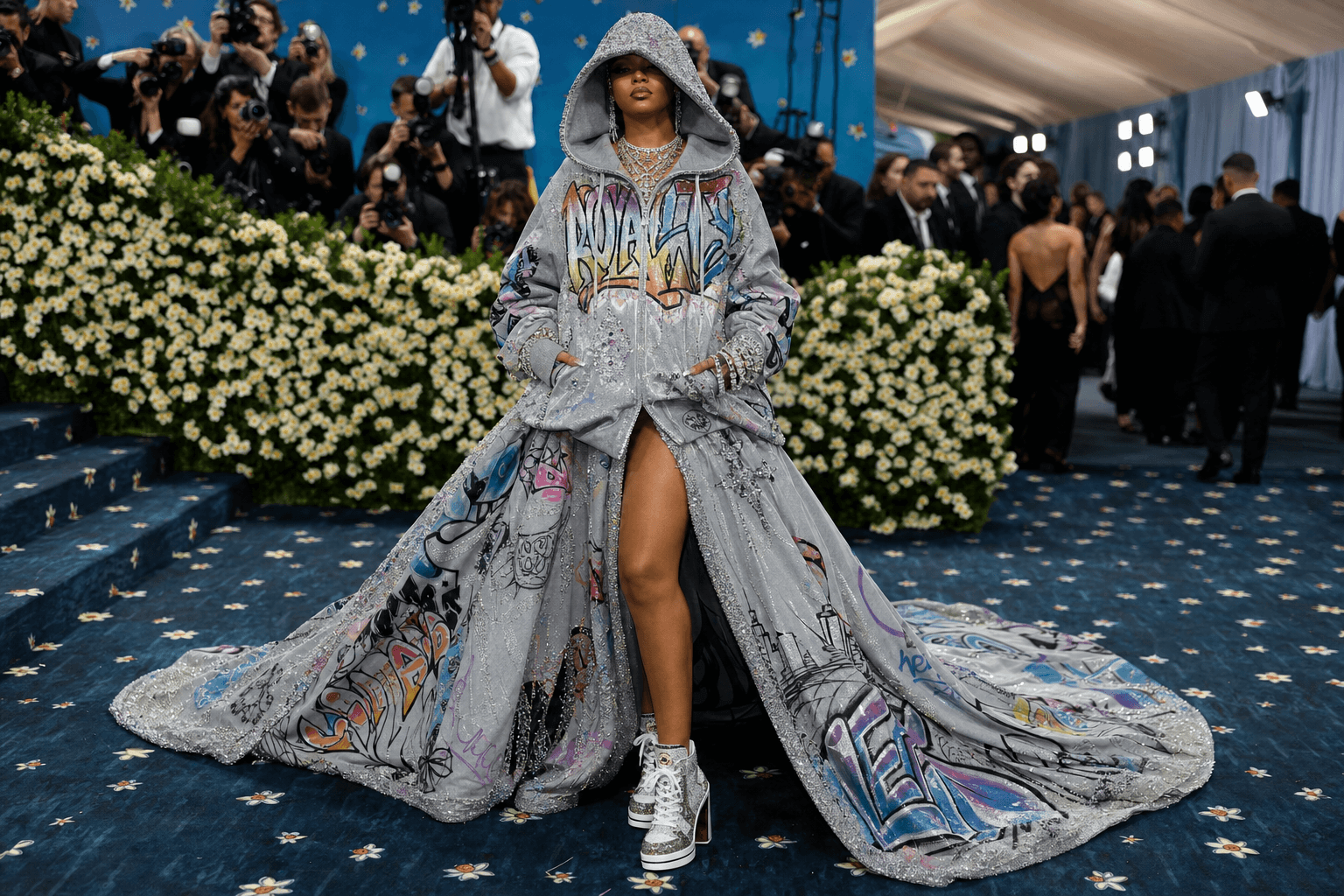 Hoodie royalty in a graffiti gown with a crystal hood on the met gala red carpet
