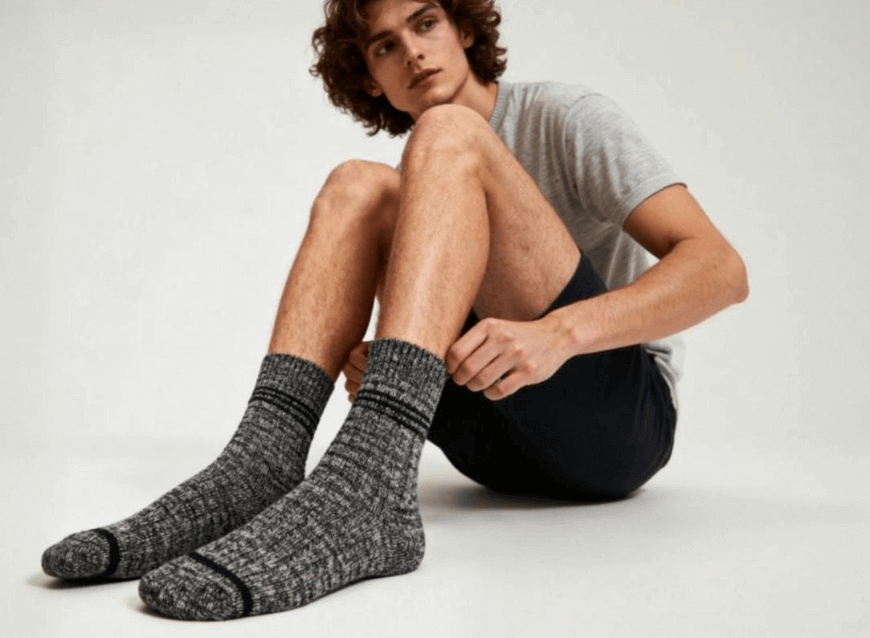 Generate a feet picture of a man wearing gray socks