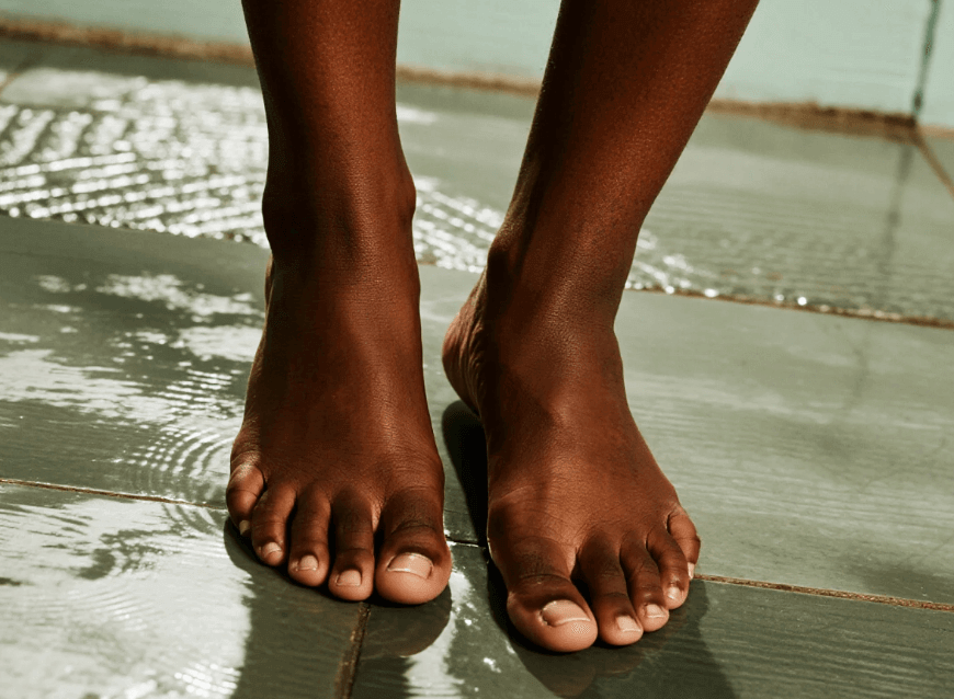 Generate an ai feet picture with dark skin tone