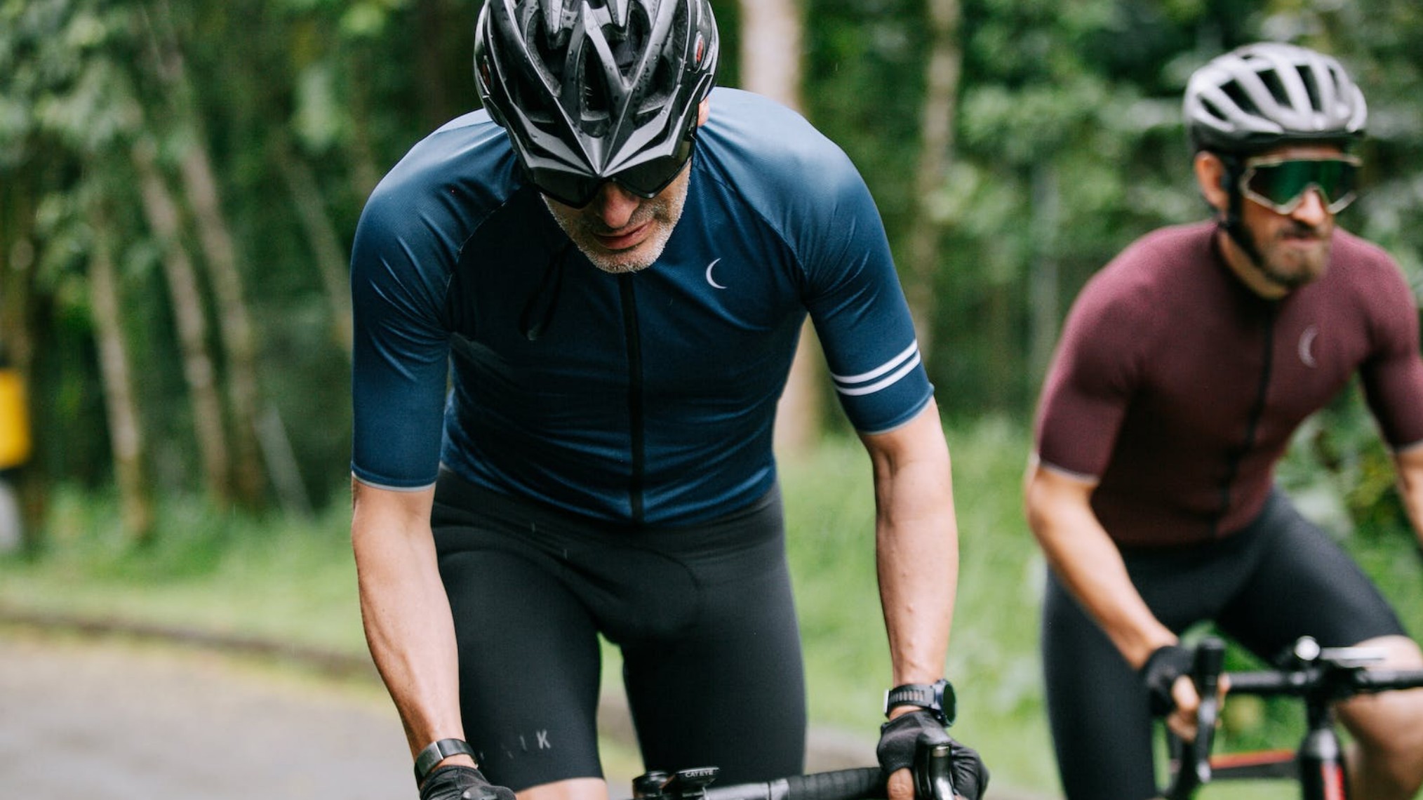 Two men riding on the road